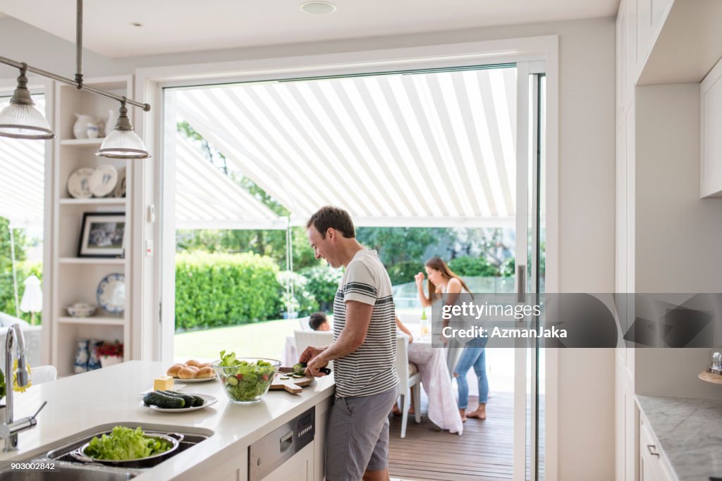 Father preparing food for barbecue