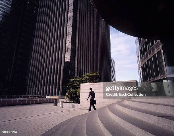 commuter arriving for work at a business district. - la defense stock pictures, royalty-free photos & images