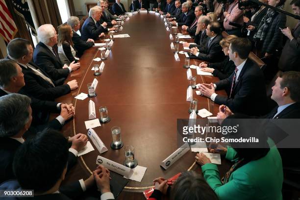 President Donald Trump presides over a meeting about immigration with Republican and Democrat members of Congress in the Cabinet Room at the White...