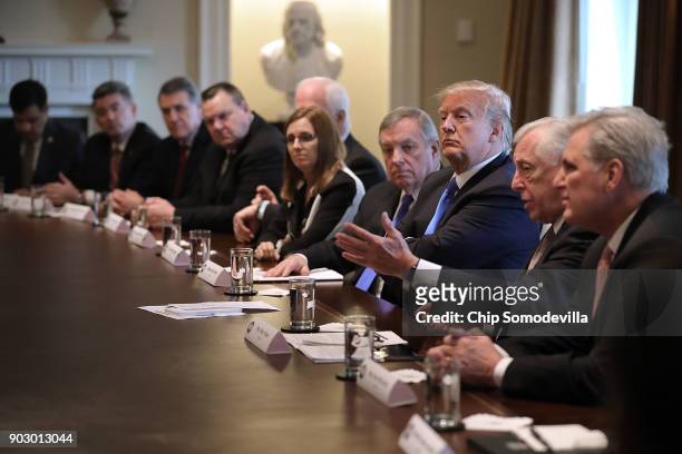 President Donald Trump presides over a meeting about immigration with Republican and Democrat members of Congress, including in the Cabinet Room at...