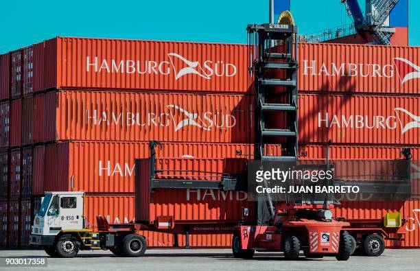 Containers are piled up at the main port of "La Guaira" in Caracas on January 9 , 2018.