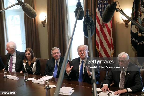 President Donald Trump presides over a meeting about immigration with Republican and Democrat members of Congress, including Senate Majority Whip...