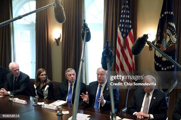 President Donald Trump presides over a meeting about immigration with Republican and Democrat members of Congress, including Senate Majority Whip...