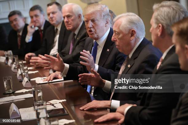 President Donald Trump presides over a meeting about immigration with Republican and Democrat members of Congress, including Sen. Cory Gardner , Sen....