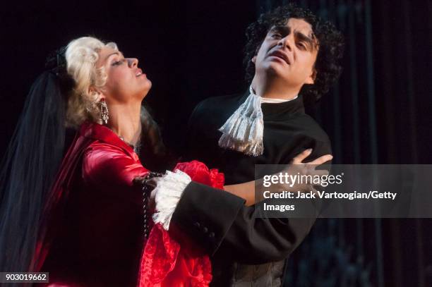 Russian soprano Anna Netrebko and Mexican-born French tenor Rolando Villazon perform during the final dress rehearsal of Act 3, scene 2 of the...