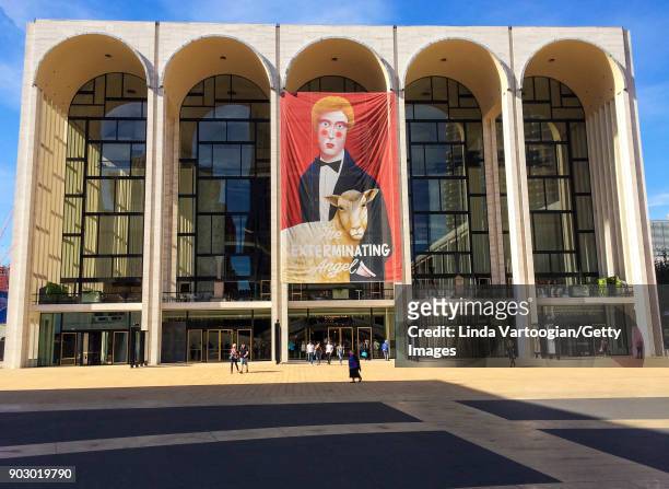 Exterior view of the Metropolitan Opera House from Lincoln Center Plaza, New York, New York, October 22, 2017. A large banner advertises the premiere...