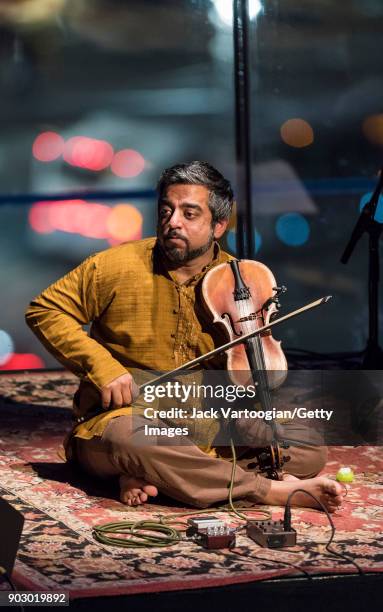 Indian musician Arun Ramamurthy plays violin as he leads his trio during a performance at the South Asian Music and Arts Association's Indo-Jazz...