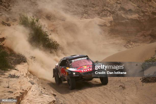 Carlos Sainz of Spain and Peugeot Total drives with co-driver Lucas Cruz of Spain in the 3008 DKR Peugeot car in the Classe : T1.4 2 Roues Motrices,...