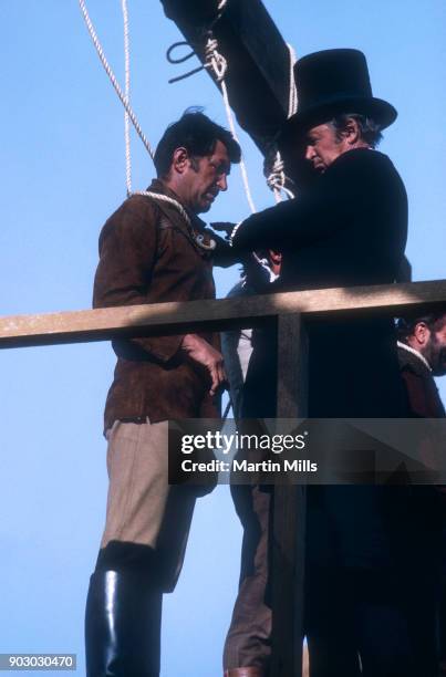 Entertainer Dean Martin and actor Jimmy Stewart play out a scene during the 20th Century Fox film 'Bandolero!' in 1967.