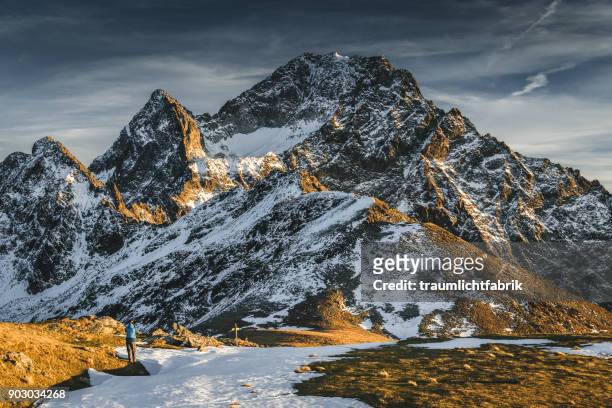 photographing a mountain peak - kühtai stock-fotos und bilder