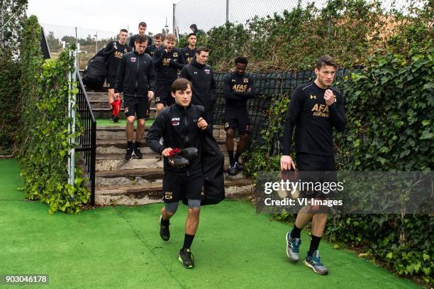 The players of AZ on their way to the training pitch with in front Joris van Overeem of AZ and Wout Weghorst of AZ during a training session of AZ...