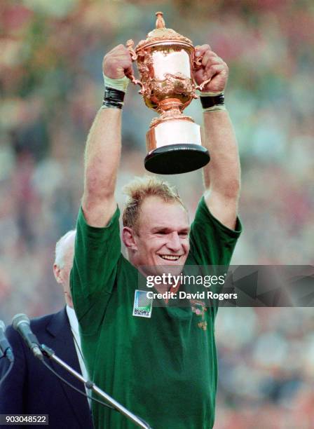 South Africa captain Francois Pienaar holds aloft the Webb Ellis trophy after their 1995 World Cup Final victory over New Zealand at Ellis Park on...