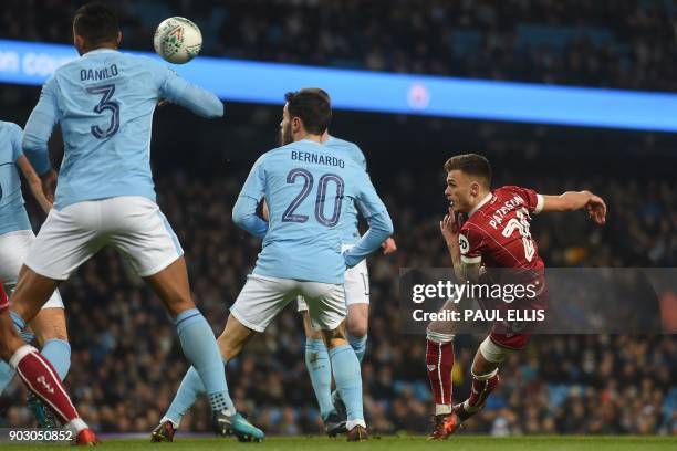 Bristol City's English midfielder Jamie Paterson has this shot blocked during the English League Cup semi-final first leg football match between...