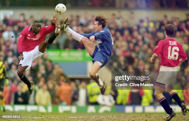 Manchester United player Andrew Cole is challenged by Craig Burley of Chelsea as Roy Keane looks on during the 1996 FA Cup Semi Final at Villa Park...