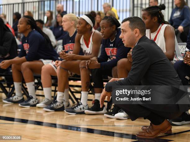 Head coach Charlie Buscaglia of the Robert Morris Colonials looks on from the bench in the first half during the game against the Monmouth Hawks at...