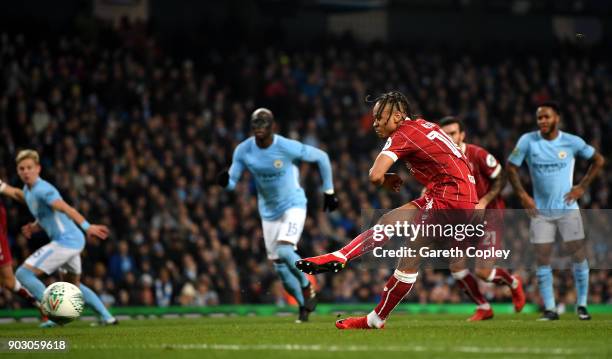 Bobby Reid of Bristol City scores their first goal from the penalty spot during the Carabao Cup Semi-Final First Leg match between Manchester City...