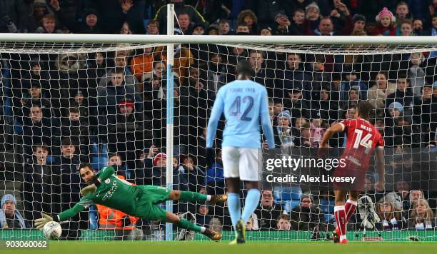 Bobby Reid of Bristol City scores their first goal from the penalty spot past Claudio Bravo of Manchester City during the Carabao Cup Semi-Final...