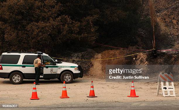 Forest Service law enforcement official prepares to investigate the ignition point of the Station Fire on Angeles Crest Highway September 2, 2009 in...