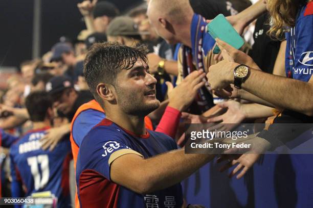 Ivan Vujica of the Jets celebrates with fans during the round 15 A-League match between the Newcastle Jets and the Central Coast Mariners at McDonald...