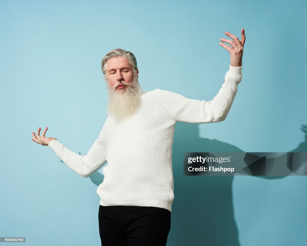 Portrait of mature man dancing and having fun