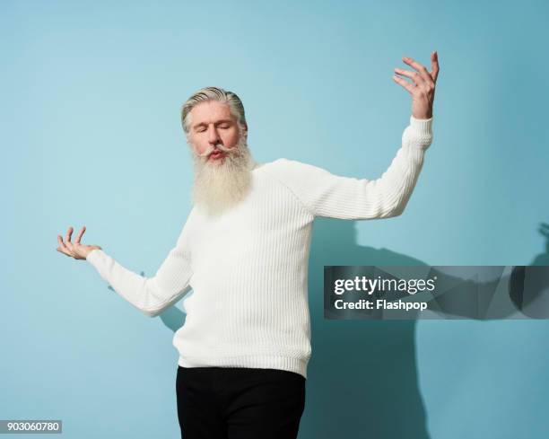 portrait of mature man dancing and having fun - masculinidade moderna imagens e fotografias de stock