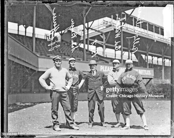 American heavyweight boxing champions James J. Jeffries and Samuel Berger stand with baseball players Ed Walsh and Billy Sullivan , both of the...