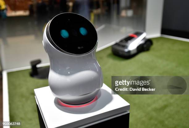 S CLOi personal assistant robot with a prototype robotic lawnmower is displayed at the LG booth during CES 2018 at the Las Vegas Convention Center on...