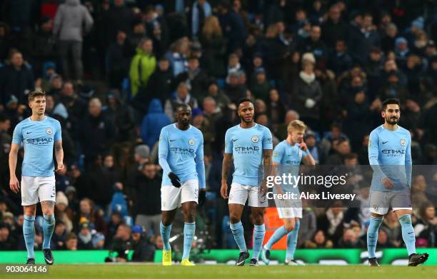 John Stones, Yaya Toure, Raheem Sterling, Alexander Zinchenko and Ilkay Gundogan of Manchester City look dejected as Bobby Reid of Bristol City...