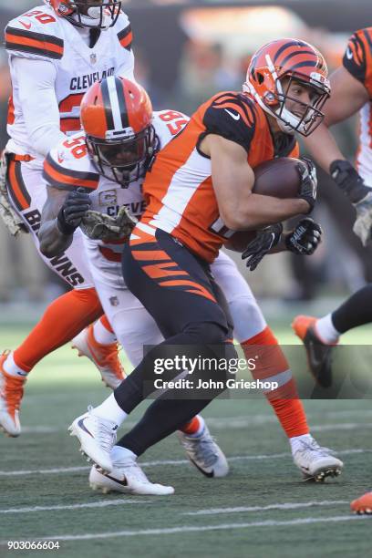 Alex Erickson of the Cincinnati Bengals runs the football upfield against Christian Kirksey of the Cleveland Browns during their game at Paul Brown...