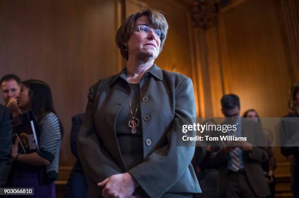 Sen. Amy Klobuchar, D-Minn., prepares for a news conference in the Capitol on reinstating net neutrality rules on January 9, 2018.