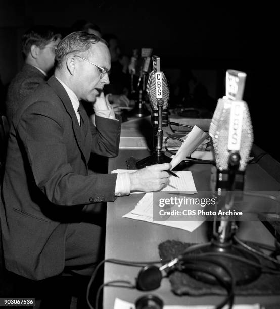 Reports the 1944 United States presidential election results. Tuesday, November 7, 1944. New York, NY. Seated at CBS microphone is newsman Quincy...