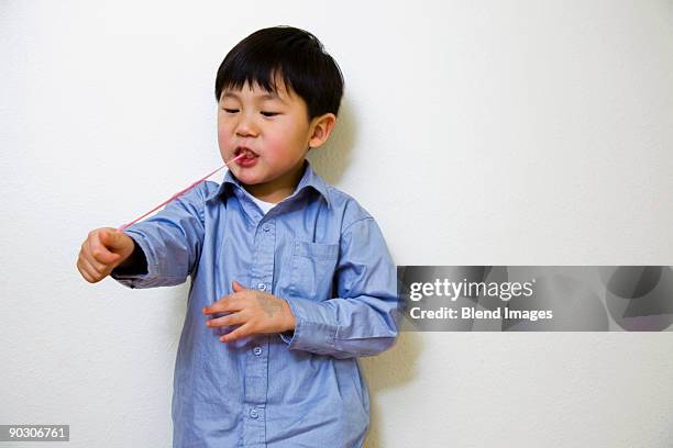 korean boy pulling gum from mouth - bubble gum kid stock pictures, royalty-free photos & images