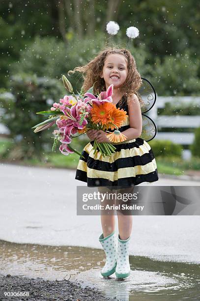 mixed race girl in bumble bee costume - tierkostüm stock-fotos und bilder