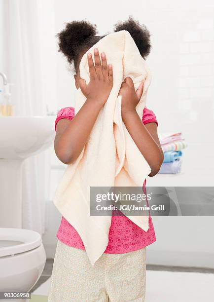 african girl drying face with towel - kid girl towel stock pictures, royalty-free photos & images