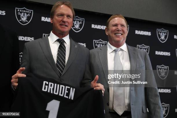 Oakland Raiders new head coach Jon Gruden and Raiders owner Mark Davis pose for a photograph during a news conference at Oakland Raiders headquarters...