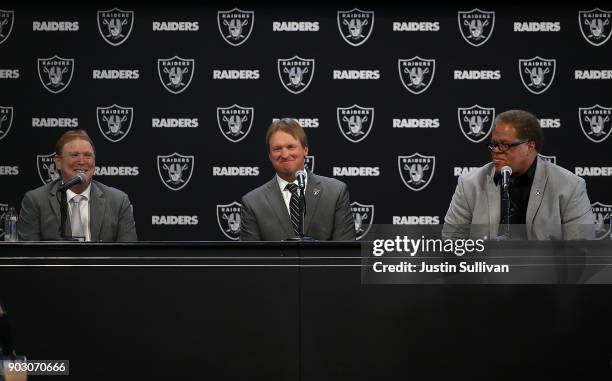 Oakland Raiders owner Mark Davis, Oakland Raiders new head coach Jon Gruden and Oakland Raiders general manager Reggie McKenzie look on during a news...