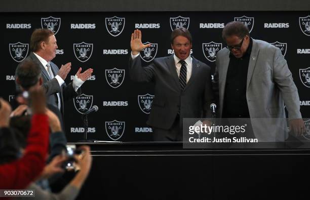 Oakland Raiders new head coach Jon Gruden waves to attendees during a news conference at Oakland Raiders headquarters on January 9, 2018 in Alameda,...