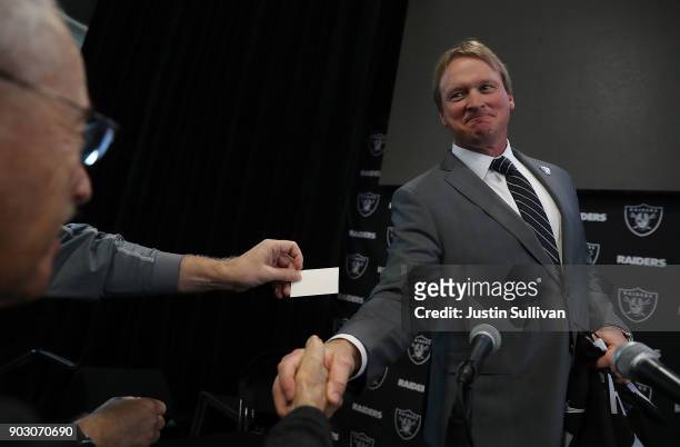 Oakland Raiders new head coach Jon Gruden greets reporters during a news conference at Oakland Raiders headquarters on January 9, 2018 in Alameda,...