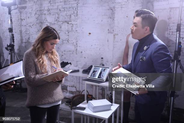 Miroslava Duma and Six Lee are seen backstage at the International Woolmark Prize 2017/2018 on January 9, 2018 in Florence, Italy.