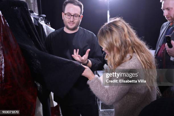 Zaid Affas and Miroslava Duma are seen backstage at the International Woolmark Prize 2017/2018 on January 9, 2018 in Florence, Italy.