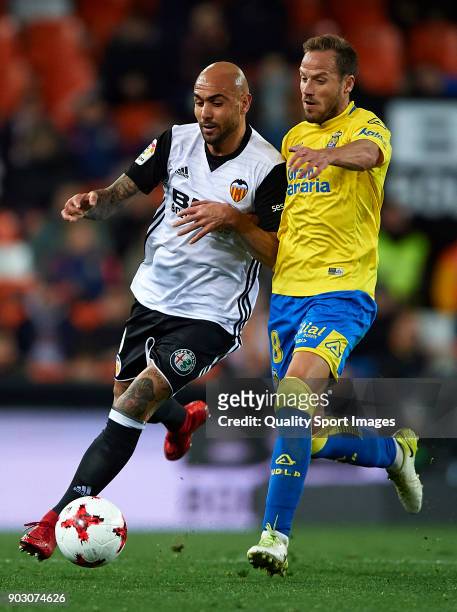 Simone Zaza of Valencia competes for the ball with Javi Castellano of Las Palmas during the Copa del Rey, Round of 16, second Leg match between...