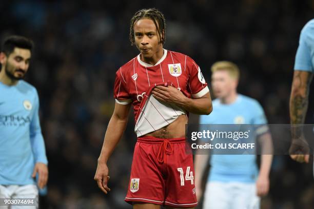 Bristol City's English striker Bobby Reid gestures during the English League Cup semi-final first leg football match between Manchester City and...