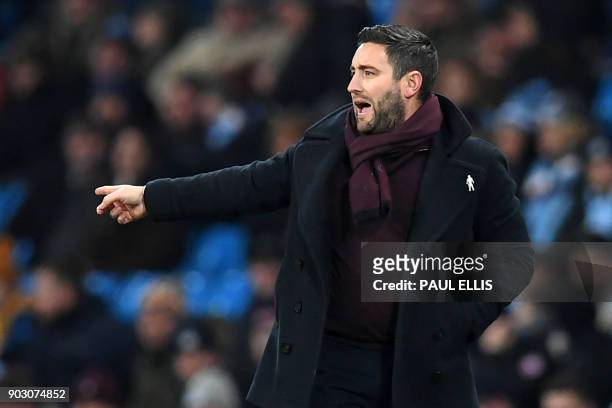 Bristol City's English manager Lee Johnson gestures on the touchline during the English League Cup semi-final first leg football match between...