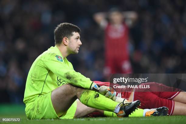 Bristol City's English goalkeeper Frank Fielding reacts after they concede a late goal during the English League Cup semi-final first leg football...