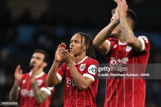 Bobby Reid of Bristol City applauds the fans at the end of the Carabao Cup Semi-Final first leg match between Manchester City and Bristol City at...