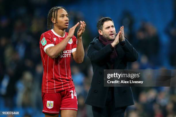 Bobby Reid of Bristol City and Lee Johnson, manager of Bristol City look dejected in defeat after the Carabao Cup Semi-Final First Leg match between...