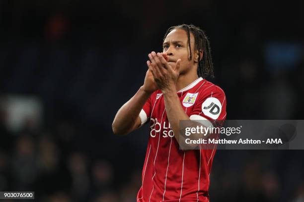 Bobby Reid of Bristol City applauds the fans at the end of the Carabao Cup Semi-Final first leg match between Manchester City and Bristol City at...