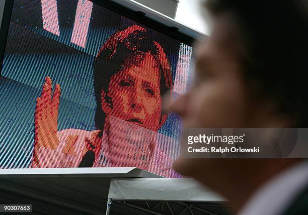 German Chancellor Angela Merkel, top candidate of the German Christian Democratic Union is broadcasted on a video screen during an election rally on...