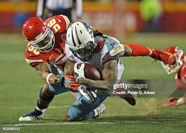 Inside linebacker Derrick Johnson of the Kansas City Chiefs tackles running back Derrick Henry of the Tennessee Titans during the second half of the...