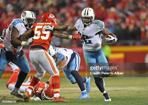 Running back Derrick Henry of the Tennessee Titans runs up field for a firstdown during the second half of the game against inside linebacker Reggie...